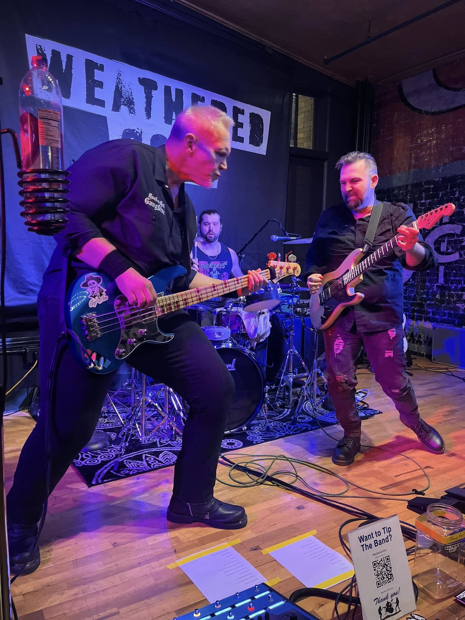 All three members on stage at 1907 Brewing