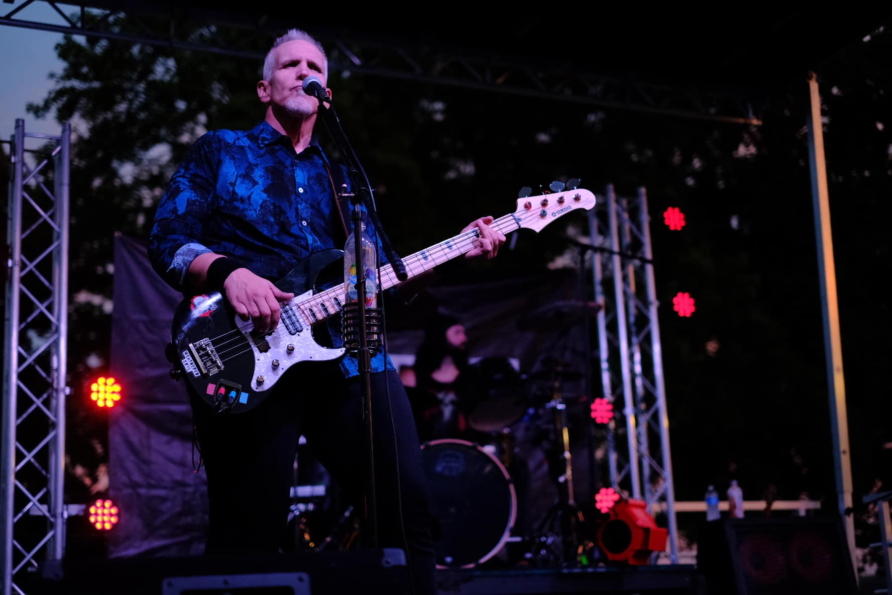 Rick Hodge playing bass on big stage